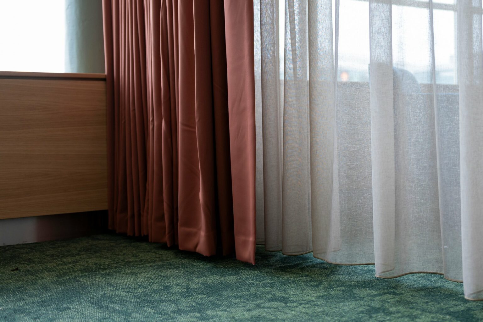 Bossa FR solid wave curtain beside a Proof FR sheer voile at Dublin Airport