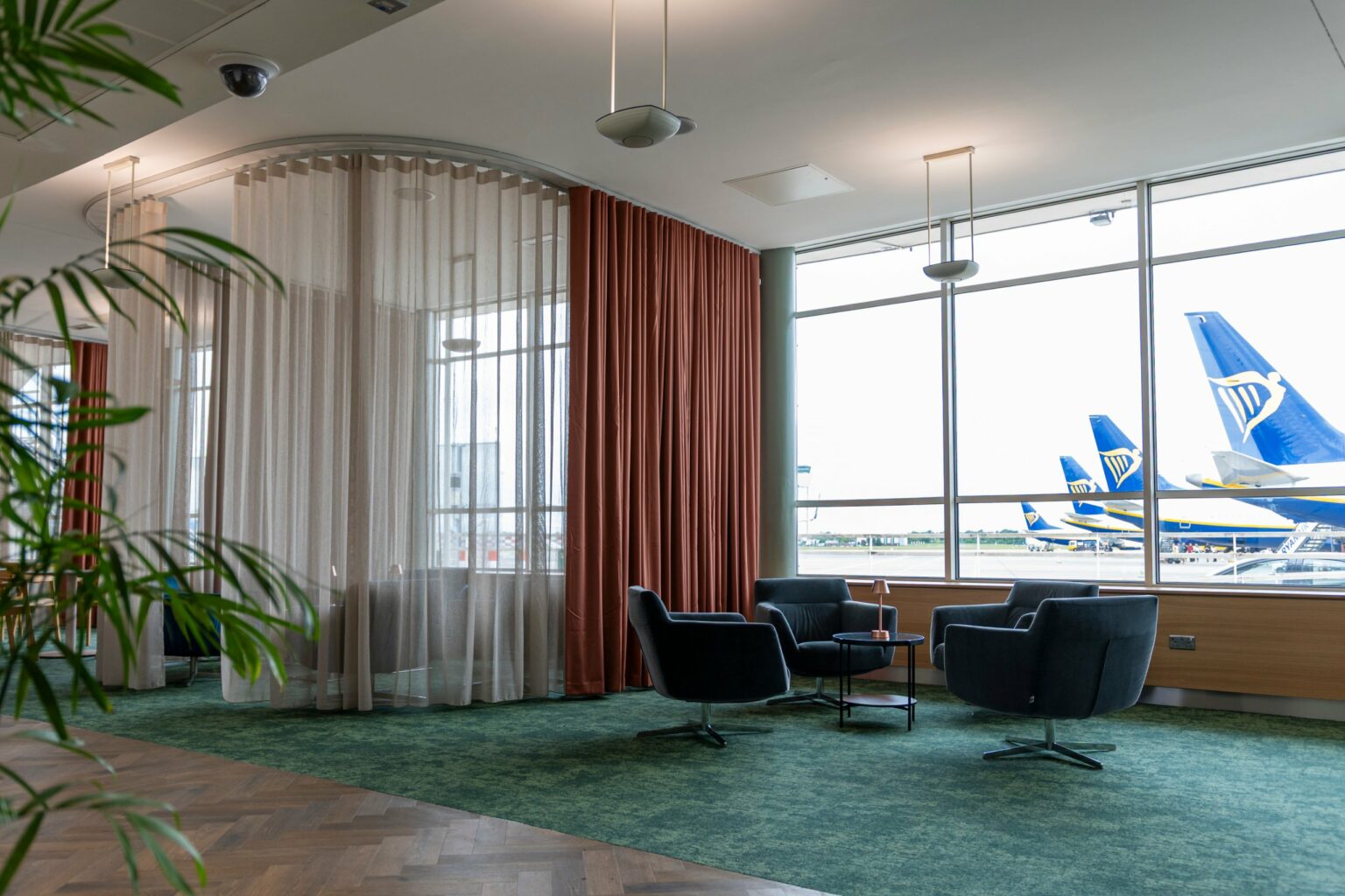 EU Presidency Lounge at Dublin Airport with terracotta Bossa FR and Proof FR sheer curtains overlooking the apron