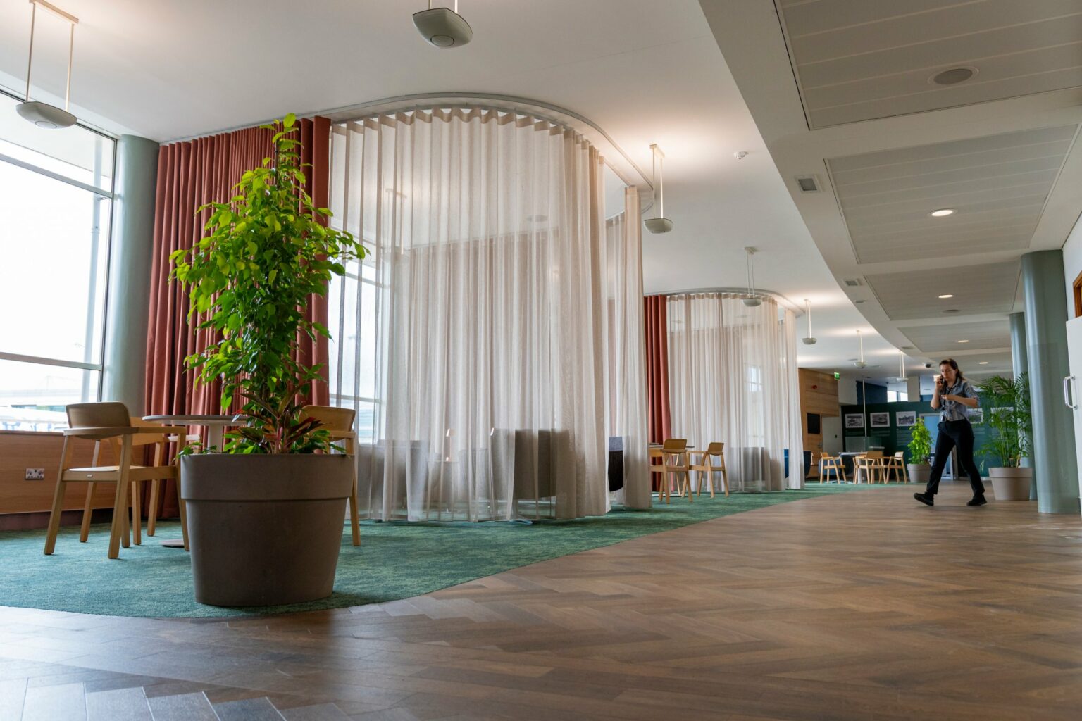 Bent curtain tracks with Bossa FR and Proof FR curtains along the Dublin Airport EU Presidency Lounge