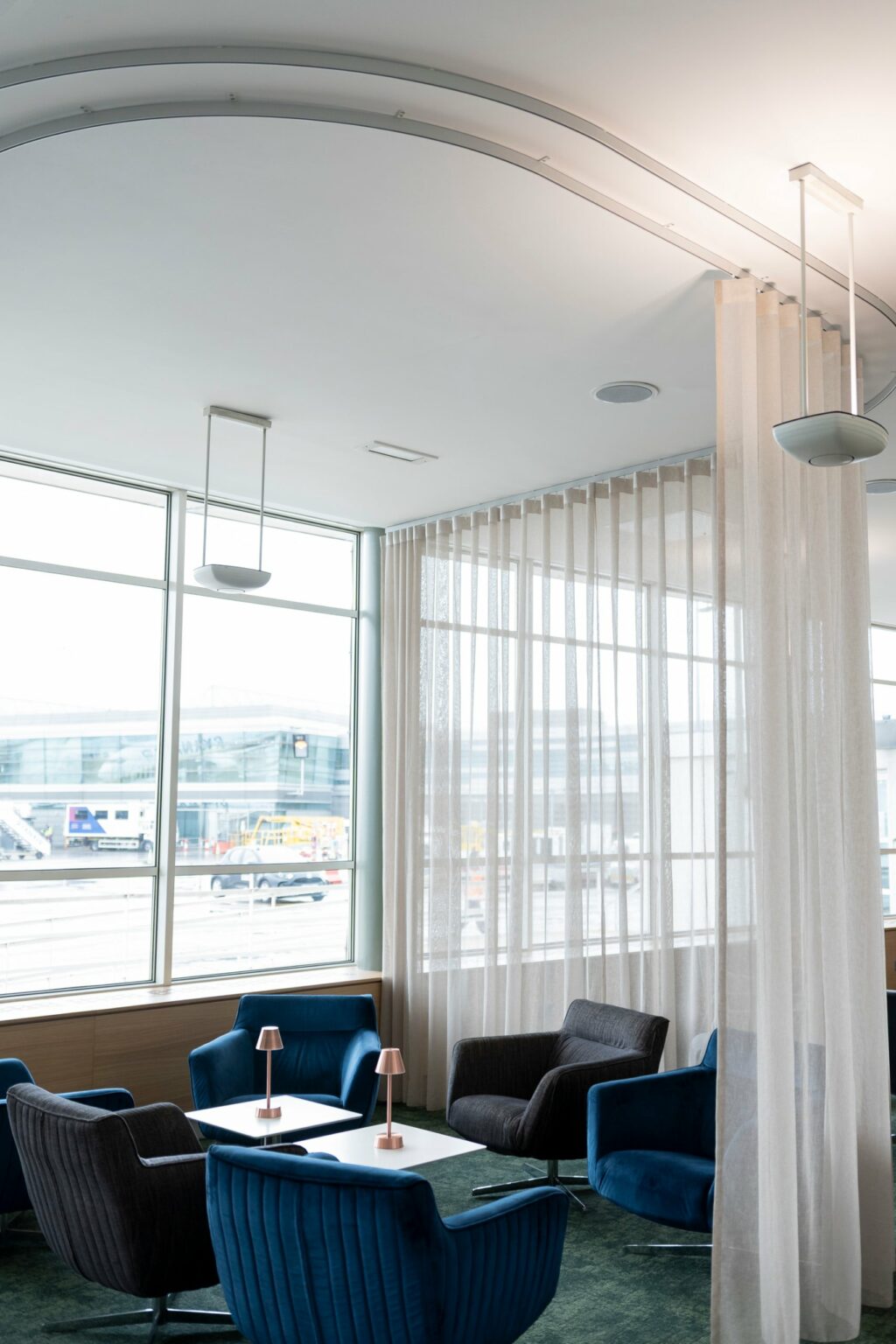 Proof FR sheer voile wave curtain on a bent track in the Dublin Airport EU Presidency Lounge