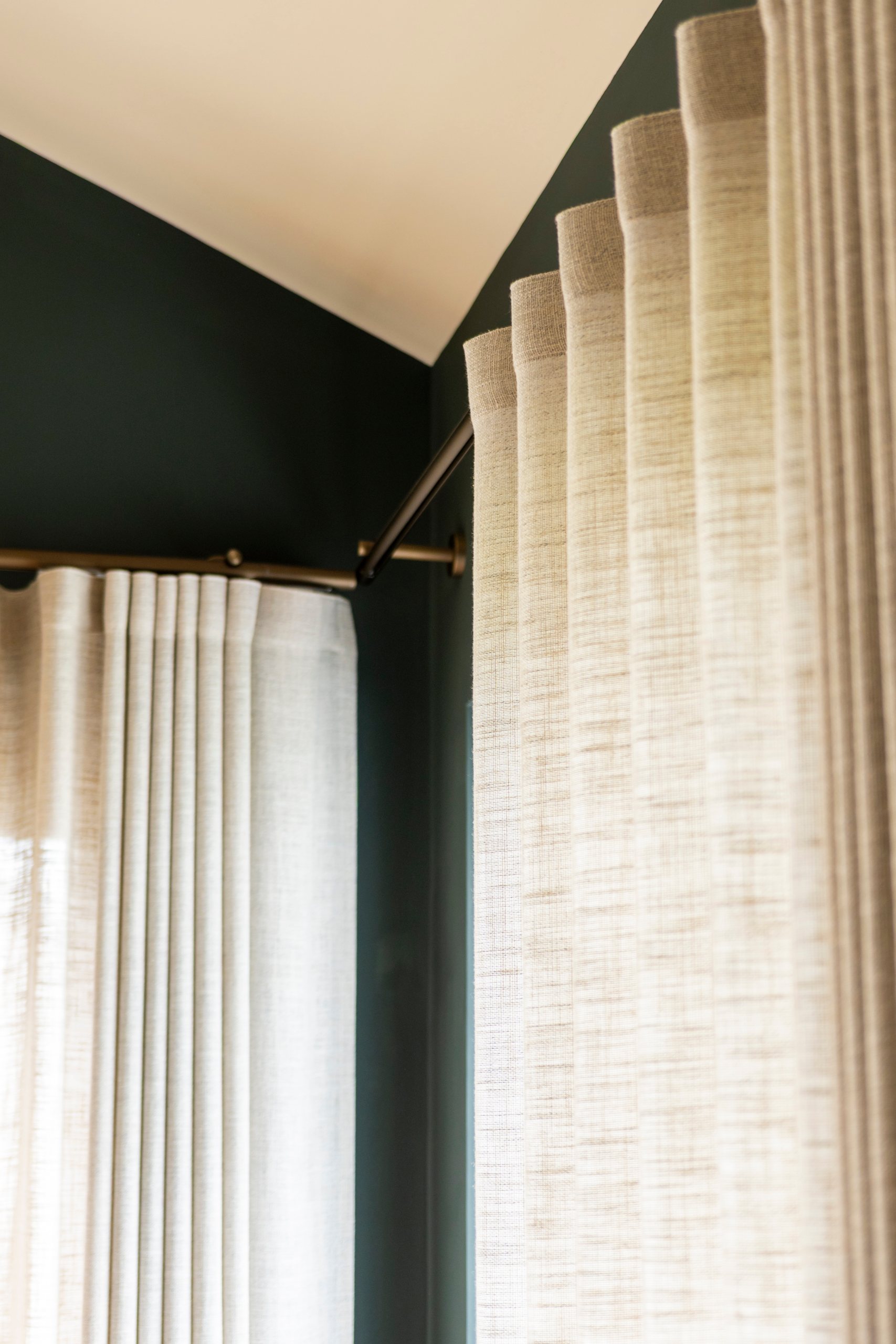 Techno 30 in satin gold with wave heading curtains