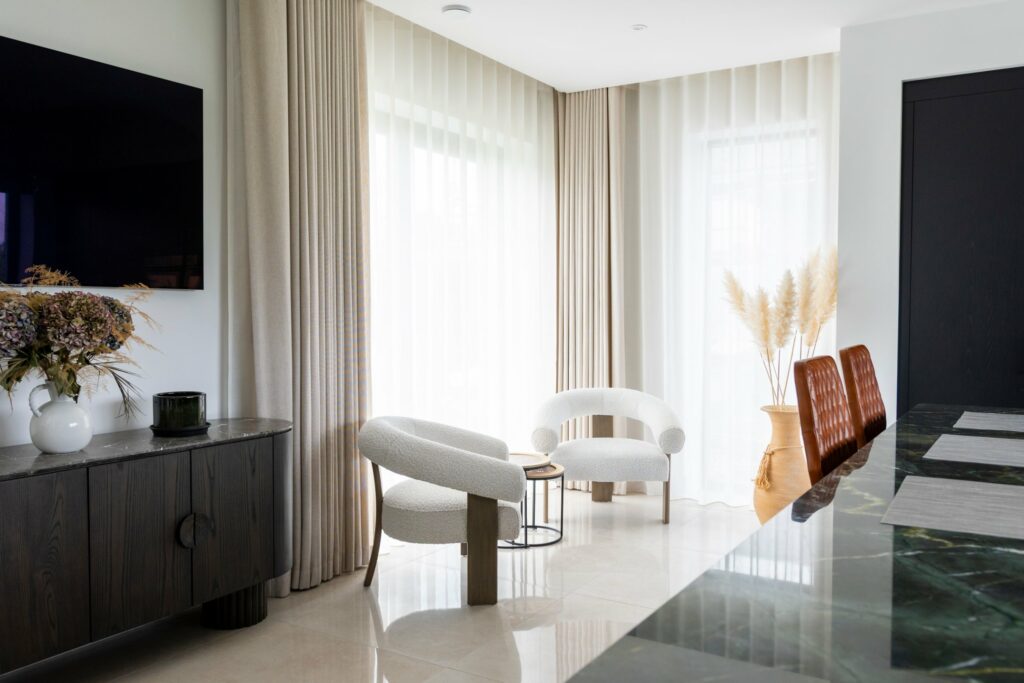 Infusion curtains and Recover voiles on motorised tracks in a Multyfarnham living space