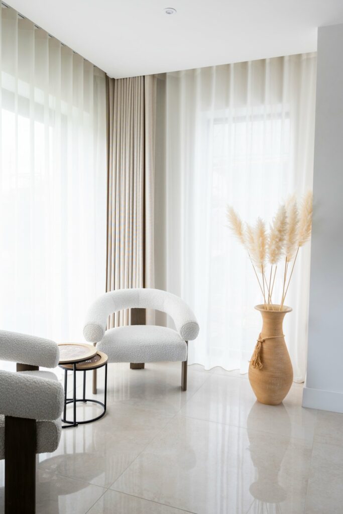 Floor-to-ceiling Recover voiles with Infusion curtains in a bright corner, Multyfarnham home