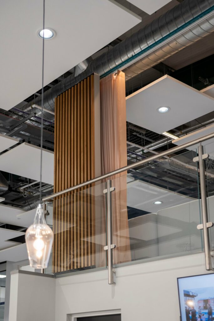 Ceiling-hung curtain beside a timber slat column at PGIM Letterkenny