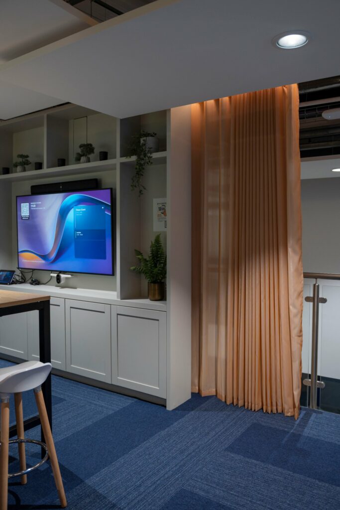 Meeting area at PGIM Letterkenny softened by a full-height curtain